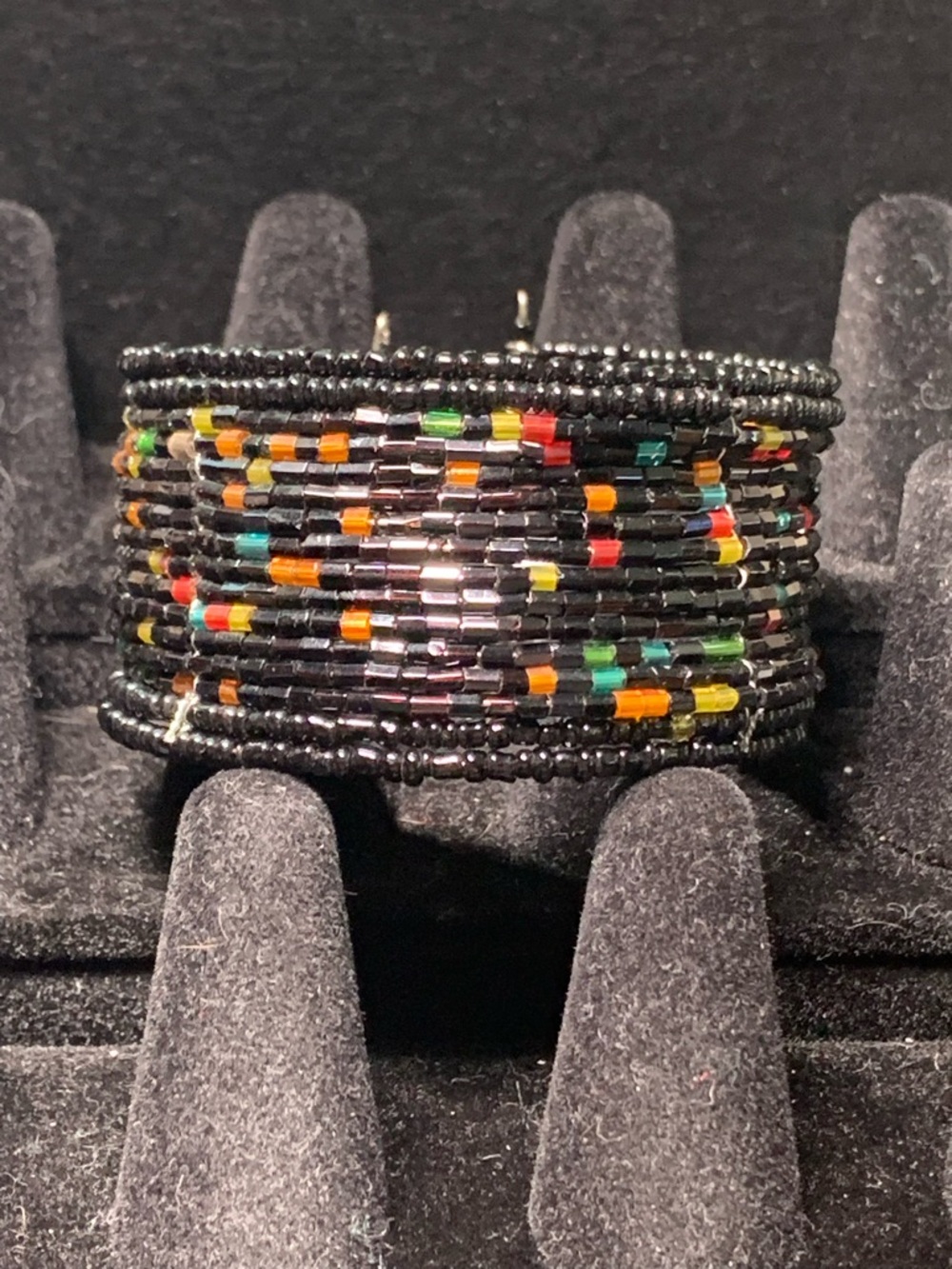 Hand Crafted Black Beaded Cuff with Red, Yellow, Green and Orange Accents